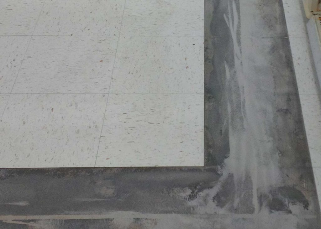 Control or contraction joints repaired with 10 Minute Concrete Mender™ under VCT.