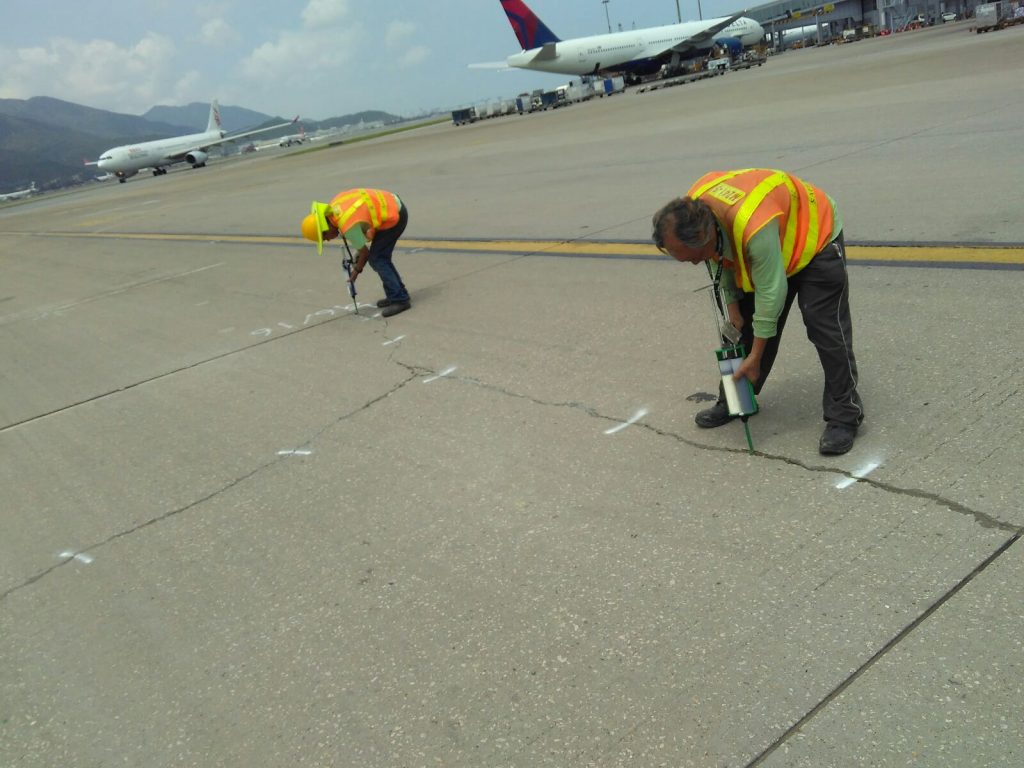 Crews use Roadware Flexible Cement II in 600ml cartridges to quickly repair concrete cracks in a taxiway at HKG airport.